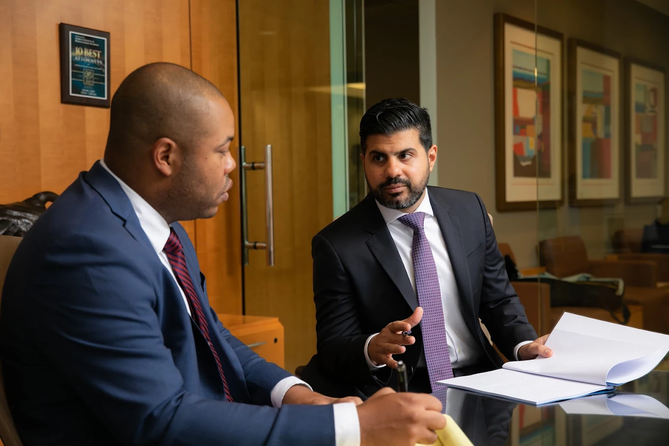ZIPI Law attorneys Zargar and Irvin reviewing a case